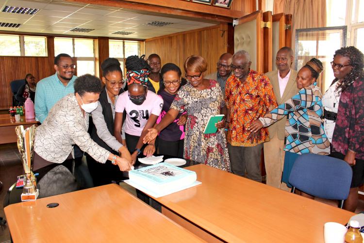 Members of the Department Celebrate With a Cake