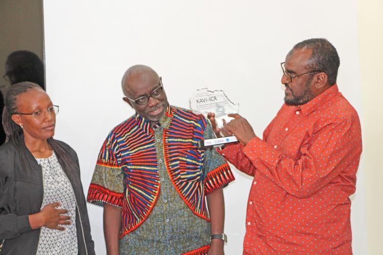 From Left to Right: Laboratory Manager Irene Mwangi, DIrector Prof. Walter Jaoko and IAVI's Bashir Farah