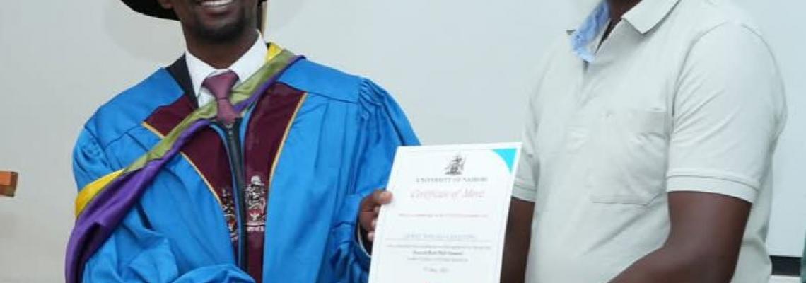 Dean of the Faculty of Health Sciences Prof. George Osanjo with Dr. James Mburu Kang’ethe